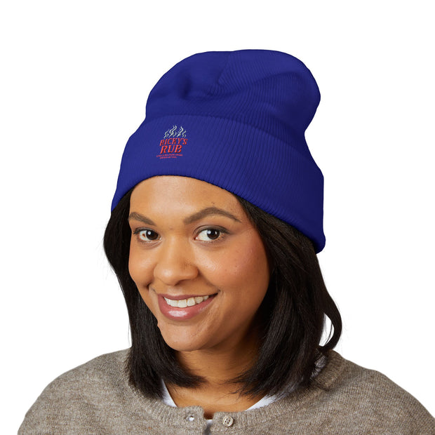 Ricky’s Rub Beanie – Classic Cuffed Winter Hat in blue with logo stitched on the front.