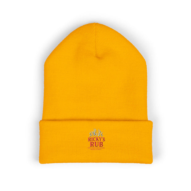 Ricky’s Rub Beanie – Classic Cuffed Winter Hat in vibrant yellow with stitched logo for warmth and style.