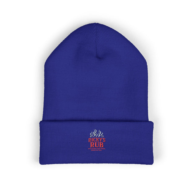 Ricky’s Rub Beanie – Classic Cuffed Winter Hat in blue with logo stitched on the front.
