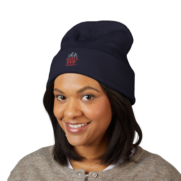 Ricky’s Rub Beanie – Classic Cuffed Winter Hat in blue with logo stitched on the front.