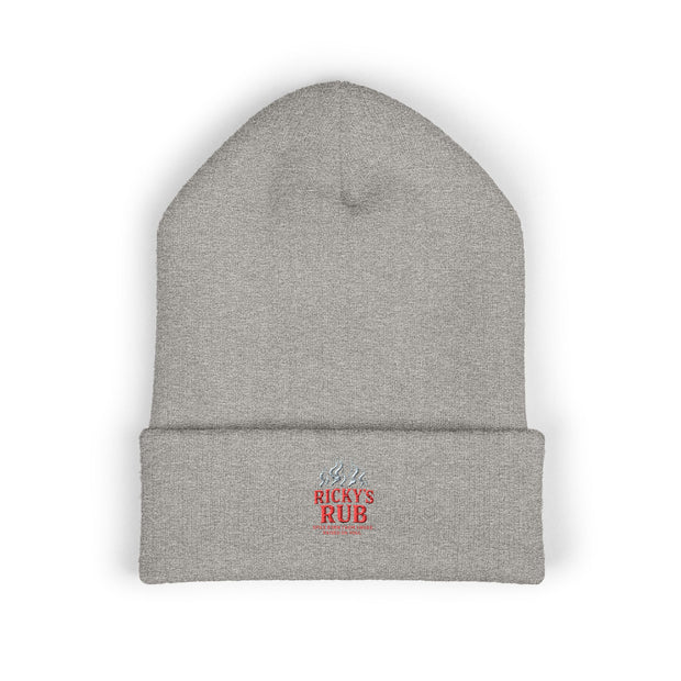 Ricky’s Rub Beanie – Classic Cuffed Winter Hat in blue with logo stitched on the front.