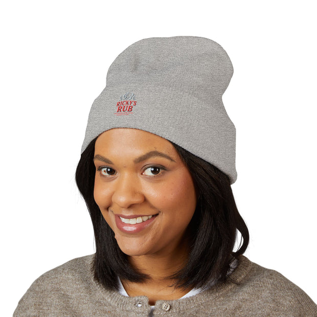 Ricky’s Rub Beanie – Classic Cuffed Winter Hat in blue with logo stitched on the front.