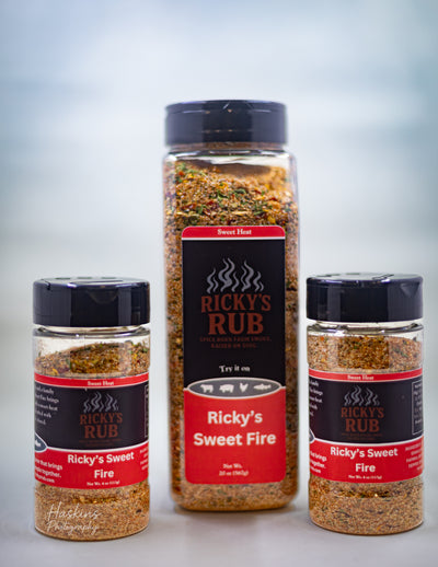 Ricky’s Sweet Fire (Sweet Heat) – Spicy & Sweet Gourmet Sauce bottles arranged on a display.